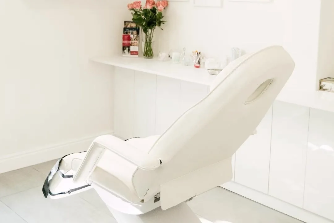 My white treatment room: the chair, the shelf, the window light